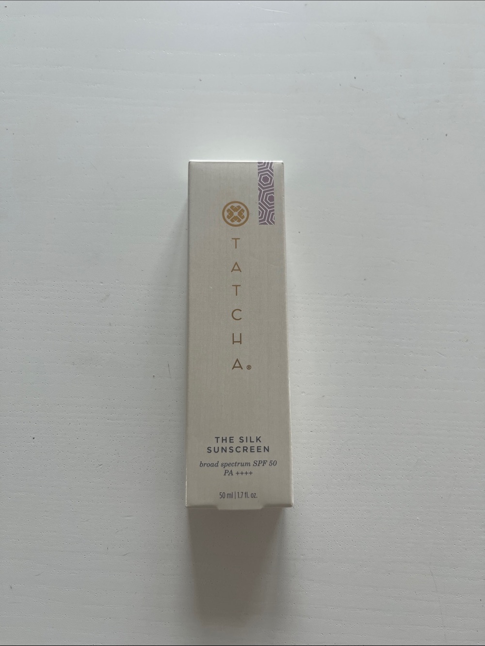 Tatcha Silk Sunscreen SPF 50 - Cream with Gold and Purple Accents